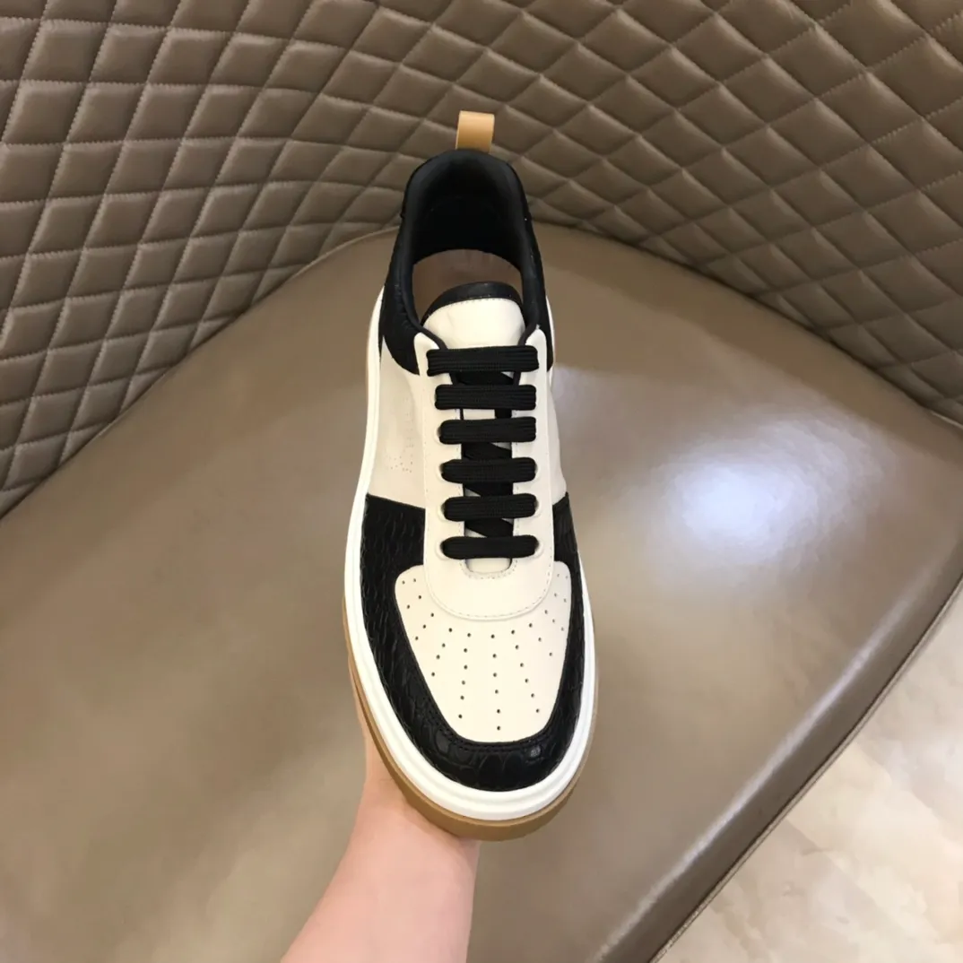 p440 "Salvatore Ferraga**" men's low-top fashion sneakers. This casual shoe has a novel structure and is made of soft calfskin. The contrasting color elements on the upper highlight the bold and avant-garde atmosphere. The first-layer cowhide lining is high-end and comfortable. Energetic and fresh, these shoes can be worn with casual looks or add a touch of street style to elegant trousers.  Size: 38-44